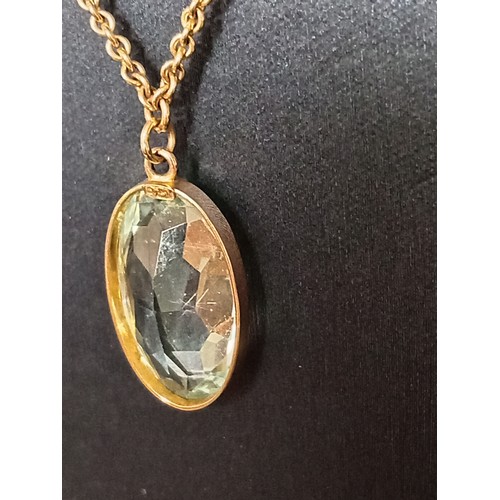 415 - 9ct gold large aquamarine coloured pendant on 40cm 9ct gold and faux pearl pendant 9.01 grams