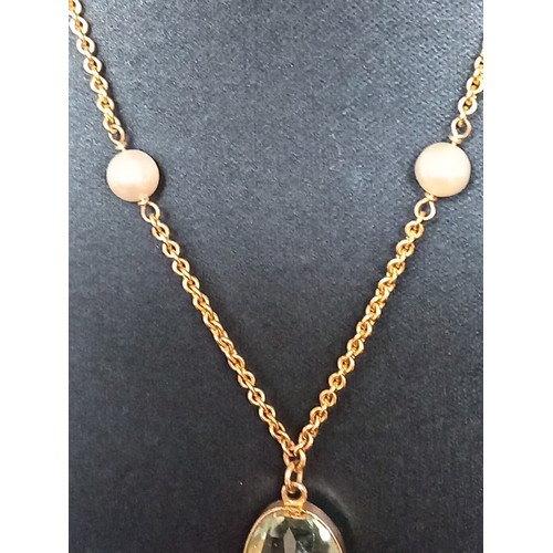 415 - 9ct gold large aquamarine coloured pendant on 40cm 9ct gold and faux pearl pendant 9.01 grams