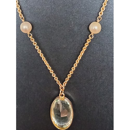 415 - 9ct gold large aquamarine coloured pendant on 40cm 9ct gold and faux pearl pendant 9.01 grams