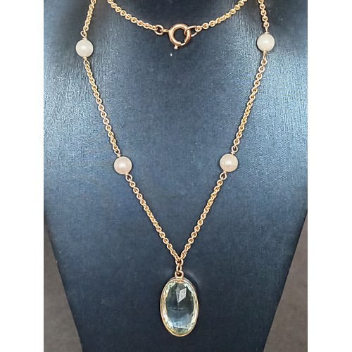 415 - 9ct gold large aquamarine coloured pendant on 40cm 9ct gold and faux pearl pendant 9.01 grams