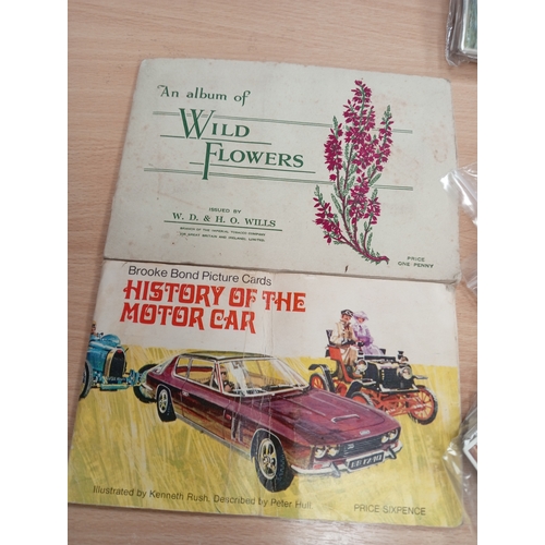 17 - Complete sets of vintage cigarette picture cards and Two albums includes flowers, cars, movie stars ... 