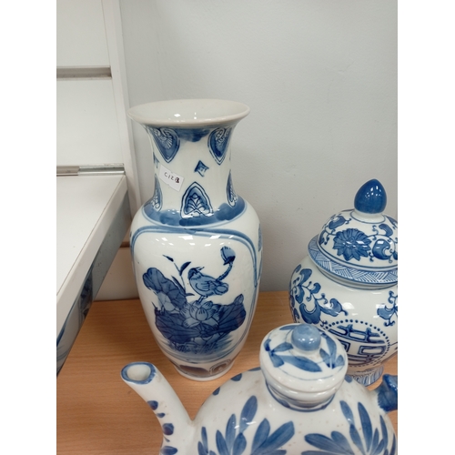 72 - Three pieces of Oriental blue and white ceramics includes vase, ginger jar and teapot