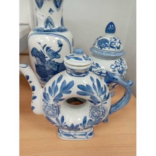 72 - Three pieces of Oriental blue and white ceramics includes vase, ginger jar and teapot