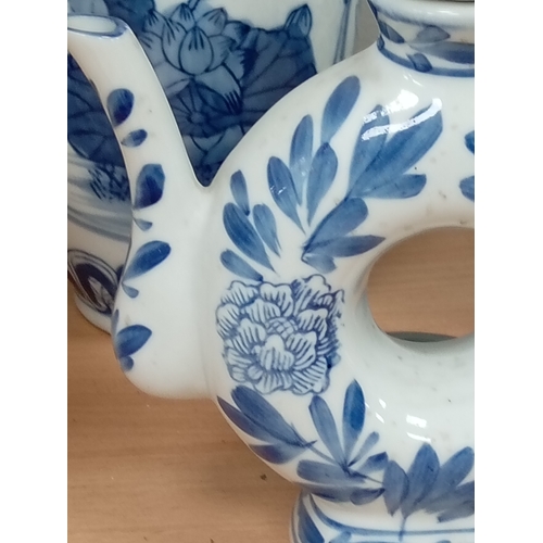 72 - Three pieces of Oriental blue and white ceramics includes vase, ginger jar and teapot