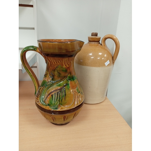 73 - Stoneware Victorian salt glazed flagon H 30cm x W 18cm and German ceramic pitcher A/F H 25cm x W 17c... 