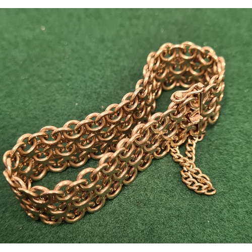 323 - 9 carat gold wide lace weave style bracelet marked 375. 5.5cm in diameter 35.6 grams