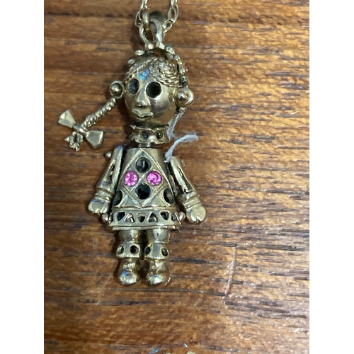 326 - 9 carat gold chain 18 inch 3.2 gram  with articulated little girl figure. Figure includes 2 pink sto... 