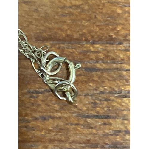 326 - 9 carat gold chain 18 inch 3.2 gram  with articulated little girl figure. Figure includes 2 pink sto... 