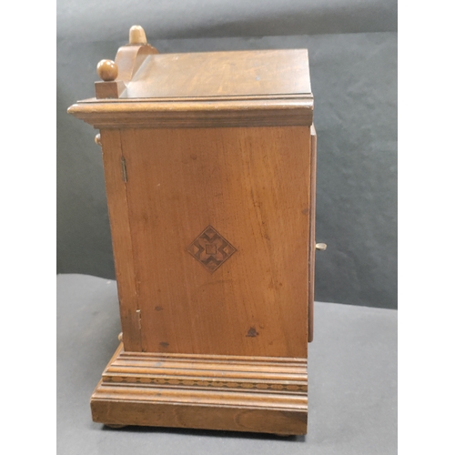 405 - Antique Oak In layed Mantel Clock complete with pendulum and key.