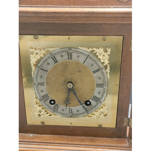 405 - Antique Oak In layed Mantel Clock complete with pendulum and key.