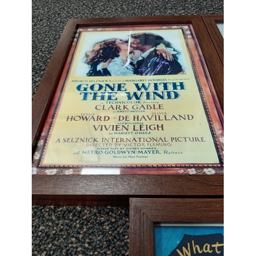 415 - Three vintage classic movie posters in wooden frames includes Gone with the wind, Guys and dolls and... 