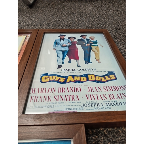 415 - Three vintage classic movie posters in wooden frames includes Gone with the wind, Guys and dolls and... 