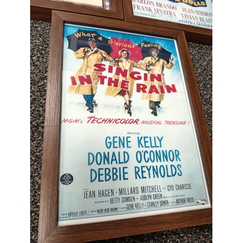 415 - Three vintage classic movie posters in wooden frames includes Gone with the wind, Guys and dolls and... 