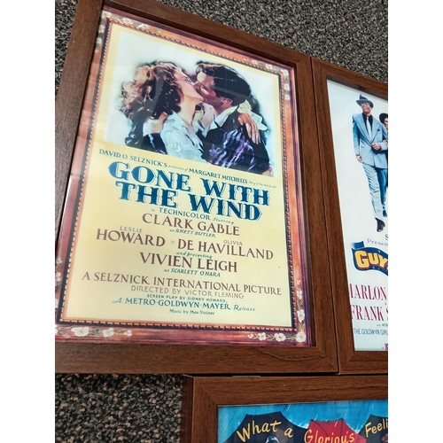 415 - Three vintage classic movie posters in wooden frames includes Gone with the wind, Guys and dolls and... 