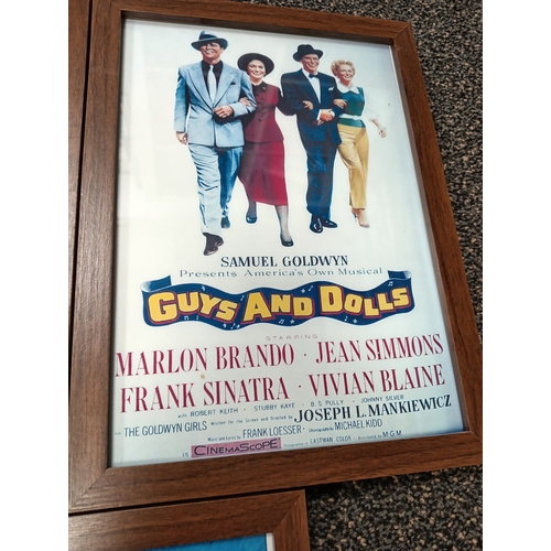 415 - Three vintage classic movie posters in wooden frames includes Gone with the wind, Guys and dolls and... 