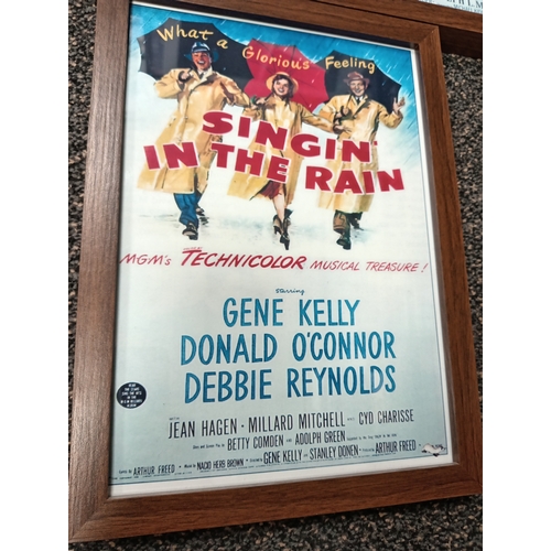 415 - Three vintage classic movie posters in wooden frames includes Gone with the wind, Guys and dolls and... 