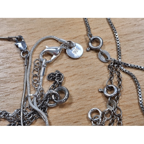 656 - Collection of 12 good quality Silver pendants, 9 with chains. Includes one locket.