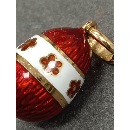 663 - Imperial collection Tatiana Faberge 18 k Gold 0.005 ct diamond enamelled egg pendant. Model number 1... 