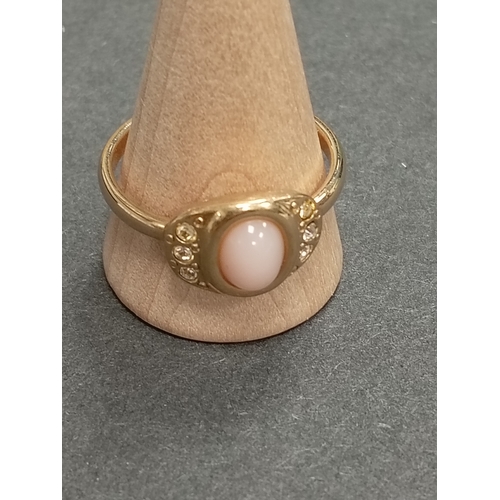 673 - Yellow metal pink coral and diamanté stone ring size V