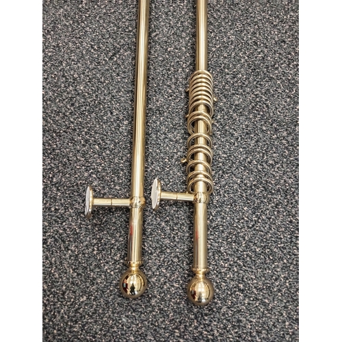 421 - Pair of brass curtain eyelet poles each measure 150cm with one set of matching tiebacks