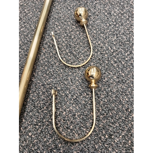 421 - Pair of brass curtain eyelet poles each measure 150cm with one set of matching tiebacks