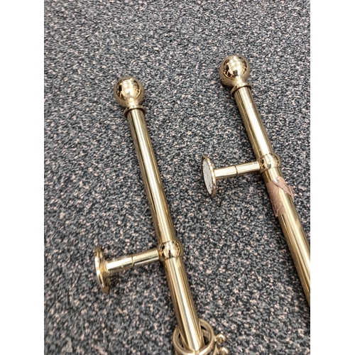 421 - Pair of brass curtain eyelet poles each measure 150cm with one set of matching tiebacks