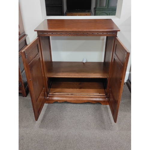 439 - Vintage Old Charm Furniture TV Cabinet with sliding shelf at the bottom.