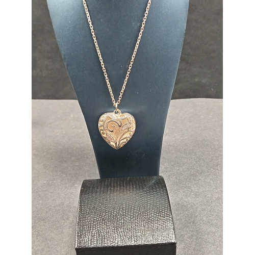 684 - Boxed 925 silver large heart pendant with scrolled diamanté detail on a 925 silver chain L 44cm