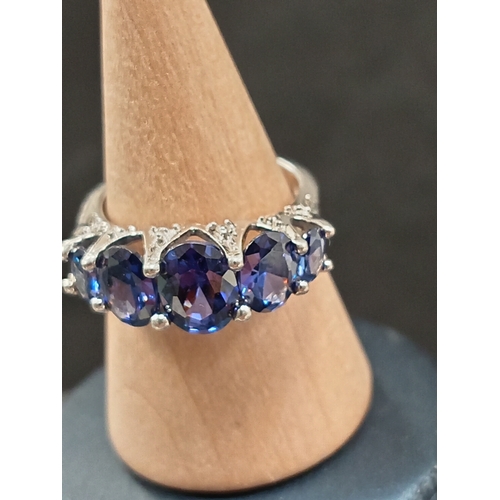 697 - 925 silver five blue stone ring size L