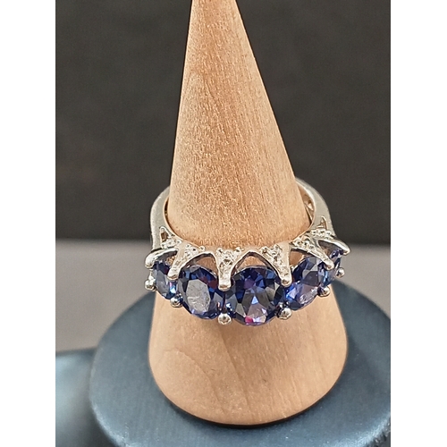 697 - 925 silver five blue stone ring size L