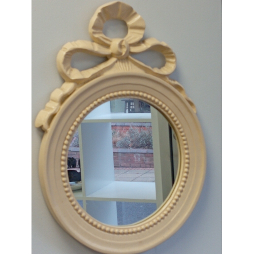 475 - Round cream mirror with ribbon detail measures H 44cm x W 33cm