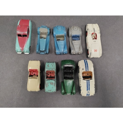 460 - Job lot of played with vintage dinky cars. To include Two Triumph Tr2s, Jaguar, Alvis and Cunningham