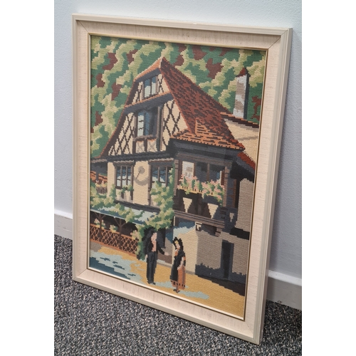 491 - Framed Cross Stitch Tapestry old style timbered house scene. H57cm x 44cm