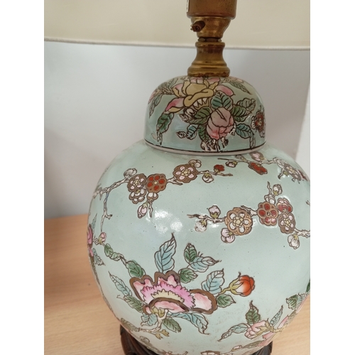 524 - Oriental ginger jar converted lamp on carved base with cream shade H 38 x W 29cm