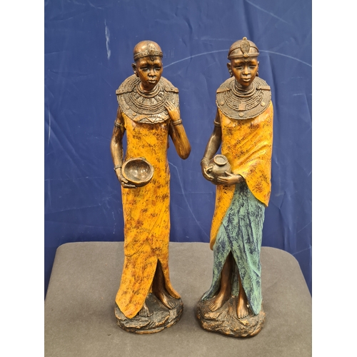 534 - A Pair of tall cast resin African lady figures in decorative native costume. One AF on head band, bo... 