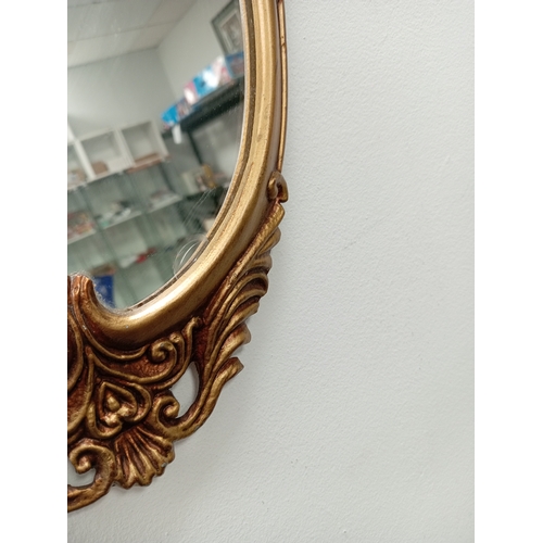 539 - Ornate gold metal framed hallway /bedroom mirror H 109cm x W 49cm slight chip in mirror