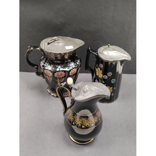 550 - Antique Victorian hand painted pitchers with pewter lids and ceramic thumb button.