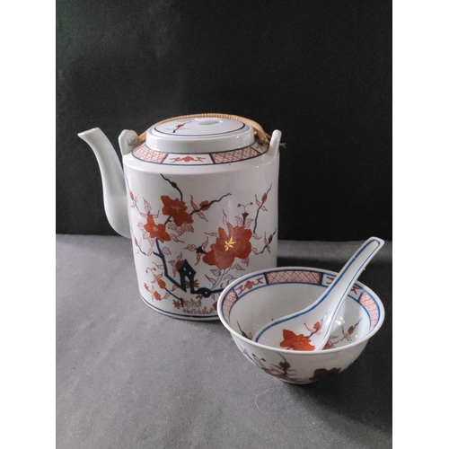 553 - Oriental Tea Pot And Bowl with spoon stamped on the bottom.