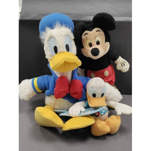 557 - Three Vintage Disneyland teddies. Includes two Donald ducks and a Mickey mouse from Walt Disney worl... 