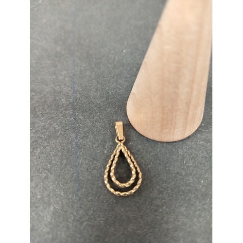 752 - 9ct gold double teardrop design pendant 1.5cm weight 0.99 grams