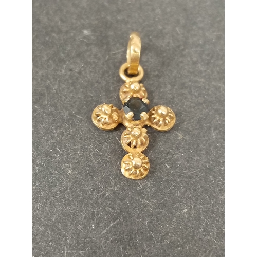 754 - 18ct gold Cross pendant with sapphire stone 1.5cm weight 0.61 grams