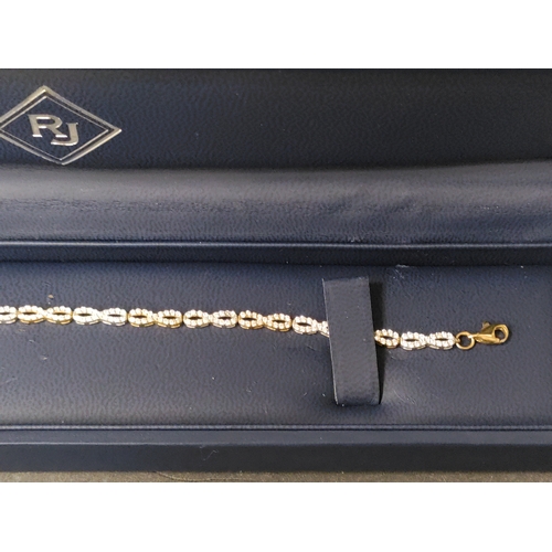 768 - 9ct White and Yellow gold bracelet cubic zirconia necklace in original box. Length 19cm. Weight 4.45... 