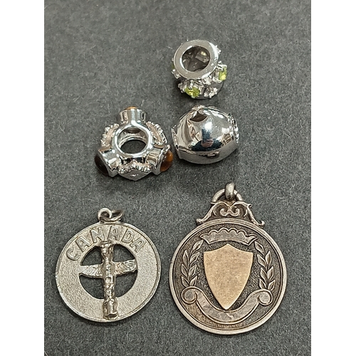 703 - Hallmarked Birmingham Silver with gold on shield fob, silver Canada fob and three 925 silver charms