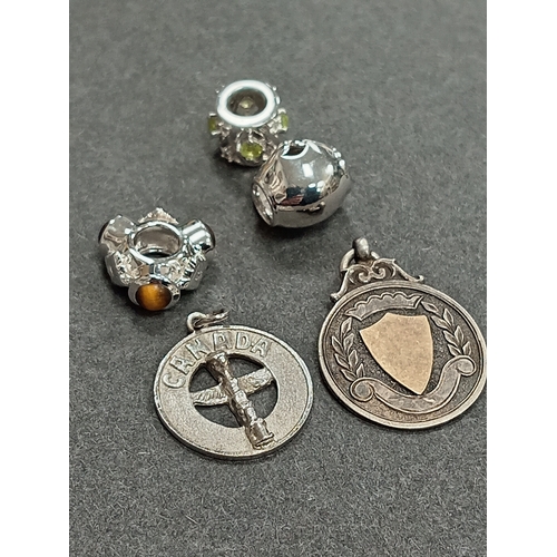 703 - Hallmarked Birmingham Silver with gold on shield fob, silver Canada fob and three 925 silver charms