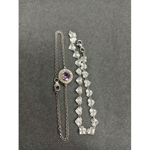 708 - Two 925 silver bracelets both measure 18cm, one heart bracelet and one amesthyst colour and diamanté... 