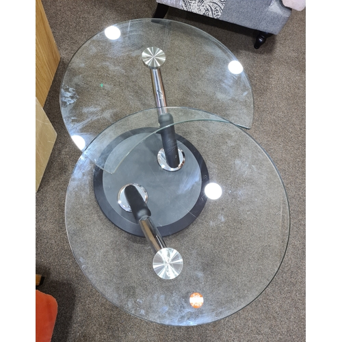 407 - Modern chromed round glass topped twist extendable coffee table which opens to the shape of an 8. H4... 