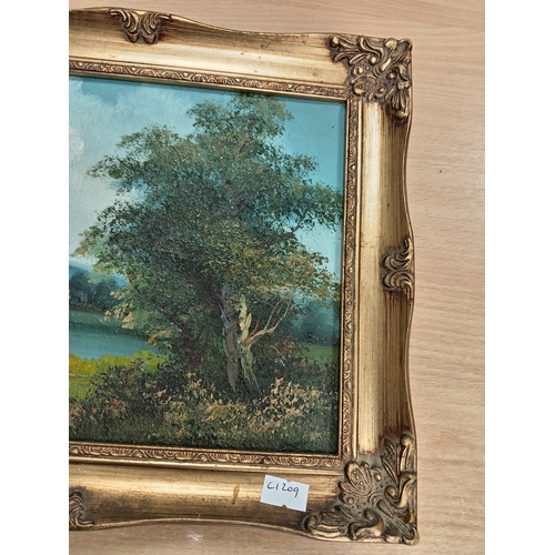 409 - Oil on canvas River scene in an ornate frame H 26cm x W 31cm