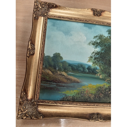 409 - Oil on canvas River scene in an ornate frame H 26cm x W 31cm