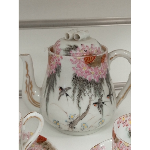 424 - Oriental Chinese teapot, milk jug and a pair of cups and saucers beautifully hand decorated