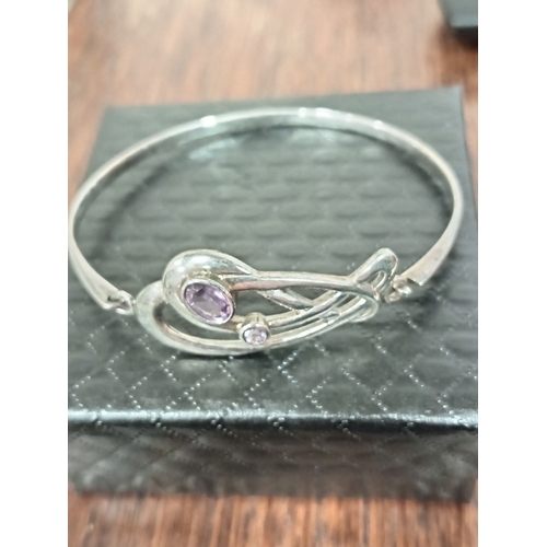 616 - 925 silver celtic and Amethyst coloured stone bangle 7cm diameter